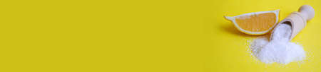 Citric acid on a yellow background. Selective focus.natureの写真素材