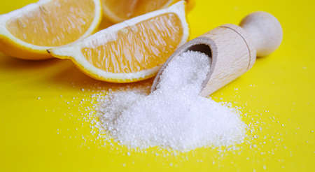 Citric acid on a yellow background. Selective focus.natureの写真素材