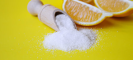 Citric acid on a yellow background. Selective focus.natureの写真素材