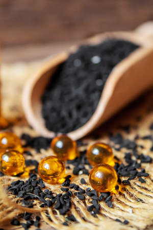 Black cumin essential oil in a small bottle. selective focus. nature.の写真素材