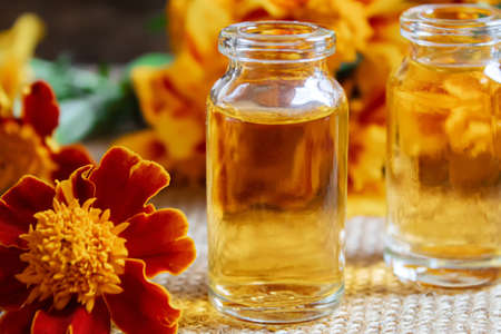 tincture of flowers of Chernobrivtsov in a small jar. selective focusの写真素材