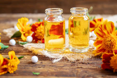 tincture of flowers of Chernobrivtsov in a small jar. selective focusの写真素材