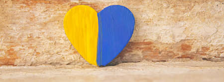 The symbol of the state flags of Ukraine Georgia and Russia is made in the shape of a heart.selective focus.symbolsの写真素材