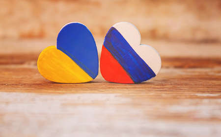 The symbol of the state flags of Ukraine Georgia and Russia is made in the shape of a heart.selective focus.symbolsの写真素材