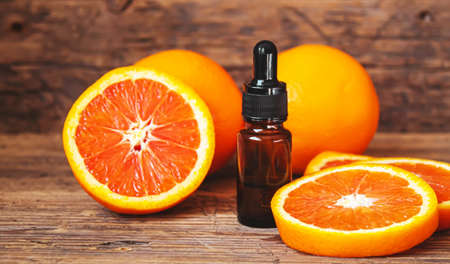 Grapefruit essential oil in a small bottle. selective focus. food.の写真素材