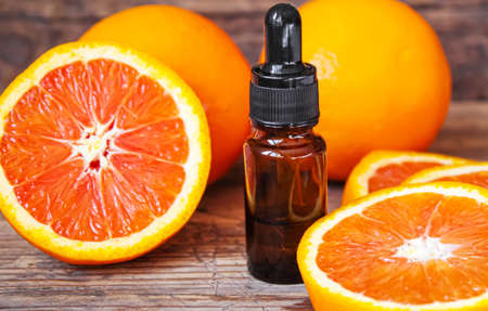 Grapefruit essential oil in a small bottle. selective focus. food.の写真素材