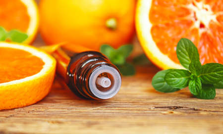 Grapefruit essential oil in a small bottle. selective focus. food.の写真素材