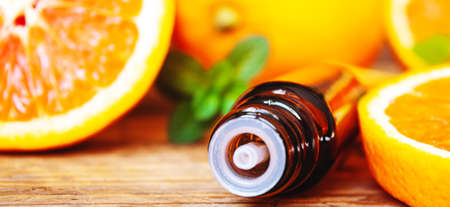 Grapefruit essential oil in a small bottle. selective focus. food.の写真素材