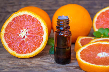 Grapefruit essential oil in a small bottle. selective focus. food.の写真素材
