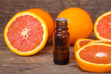 Grapefruit essential oil in a small bottle. selective focus. food.の写真素材