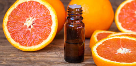 Grapefruit essential oil in a small bottle. selective focus. food.の写真素材