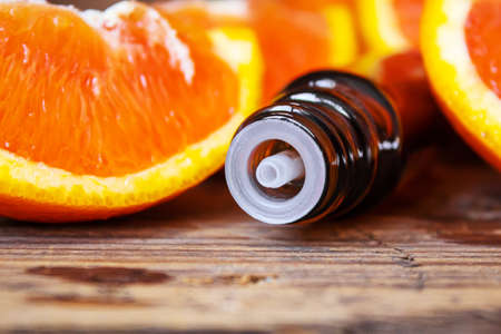 Grapefruit essential oil in a small bottle. selective focus. food.の写真素材