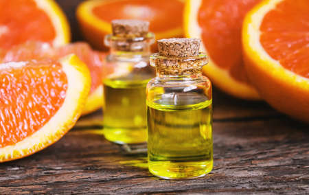 Grapefruit essential oil in a small bottle. selective focus. food.の写真素材