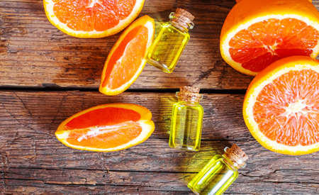 Grapefruit essential oil in a small bottle. selective focus. food.の写真素材