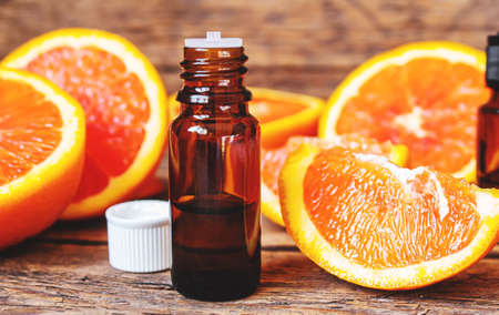 Grapefruit essential oil in a small bottle. selective focus. food.の写真素材