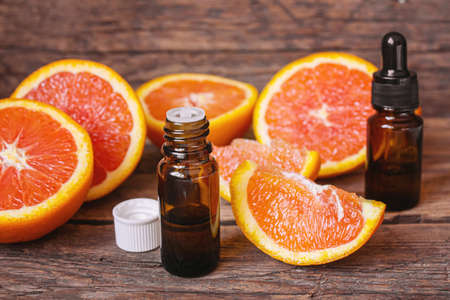 Grapefruit essential oil in a small bottle. selective focus. food.の写真素材