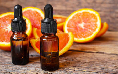 Grapefruit essential oil in a small bottle. selective focus. food.の写真素材