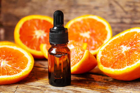 Grapefruit essential oil in a small bottle. selective focus. food.の写真素材