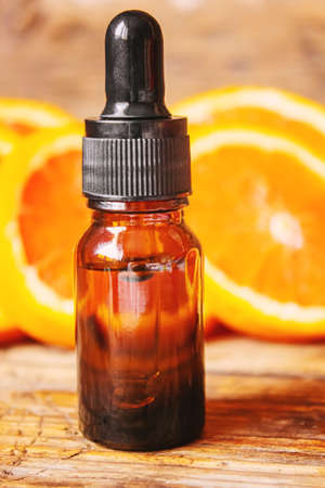 Grapefruit essential oil in a small bottle. selective focus. food.の写真素材