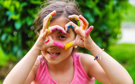 Children's hands in the colors of summer. Selective focus.artsの写真素材