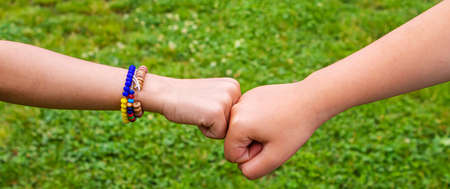 The children put their hands together. selective focus. kids