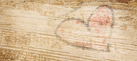 heart drawn on an old wooden background. selective focus .natureの写真素材