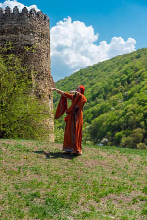 Georgian girl in national costume dances Georgian national dances. selective focus peopleの写真素材