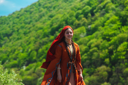 Georgian girl in national costume dances Georgian national dances. selective focus peopleの写真素材