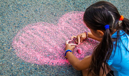 Childrens drawings on the asphalt with chalk. Selective focus.の写真素材