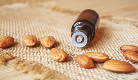 Almond essential oil in a small bottle. selective focus foodの写真素材