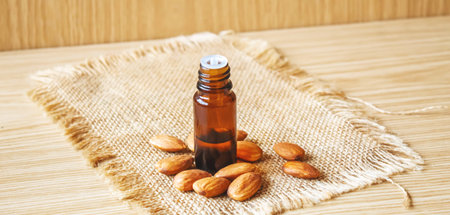 Almond essential oil in a small bottle. selective focus foodの写真素材