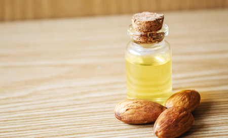 Almond essential oil in a small bottle. selective focus foodの写真素材