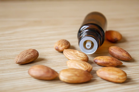 Almond essential oil in a small bottle. selective focus foodの写真素材