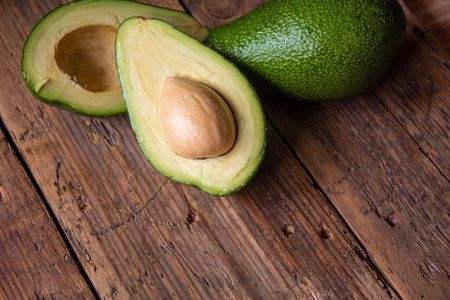 Avocado and avocado oil on wooden background. selective focus foodの写真素材