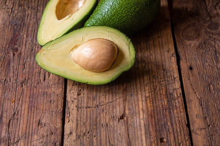 Avocado and avocado oil on wooden background. selective focus foodの写真素材
