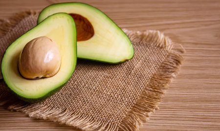 Avocado and avocado oil on wooden background. selective focus foodの写真素材