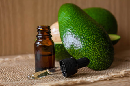 Avocado and avocado oil on wooden background. selective focus foodの写真素材