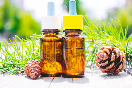 Fir tree essential oil in small bottles. Selective focus.natureの写真素材