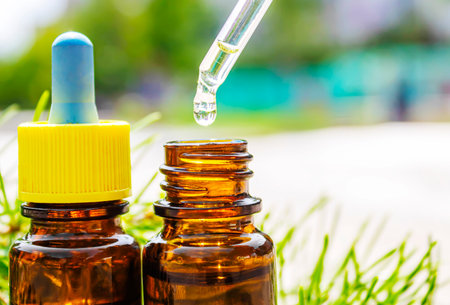 Fir tree essential oil in small bottles. Selective focus.natureの写真素材
