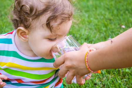 child glass of water. food selective focus. Childrenの写真素材
