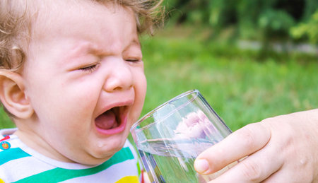 child glass of water. food selective focus. Childrenの写真素材