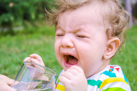 child glass of water. food selective focus. Childrenの写真素材