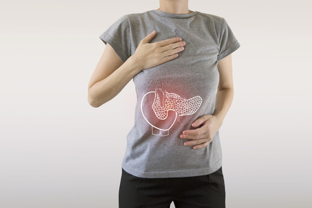 Digital composite of highlighted red pancreas of woman / pancreatitis / cholecystitis / cholelitthiasisの写真素材