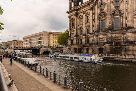 13 May 2019 Berlin, Germany - Beautiful view of historic Berlin Cathedral (Berliner Dom) at famous Museumsinsel (Museum Island) with excursion boat on Spree riverのeditorial素材
