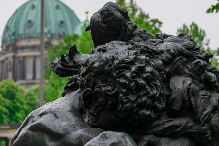 13 May 2019 Berlin, Germany - The Sculpture of Hercules and the Nemean Lion by Max Klein inside of the Colonnade Park of the Museum Island in Berlin, Germanyのeditorial素材