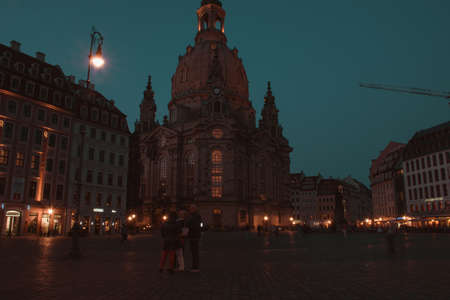 17 May 2019 Dresden, Germany - Lutheran church Dresden Frauenkirche in Dresden, many tourists at Neumarkt. Nightscene with many street lights and building illuminationのeditorial素材