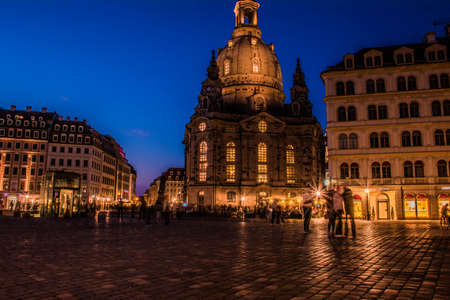 17 May 2019 Dresden, Germany - Lutheran church Dresden Frauenkirche in Dresden, many tourists at Neumarkt. Nightscene with many street lights and building illuminationのeditorial素材