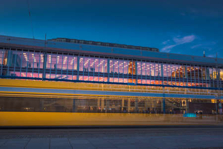 17 May 2019 Dresden, Germany - Public transportation in Dresden. Tram leaving the station, traffic lights, street, rails. Lights in night, long exposure.のeditorial素材