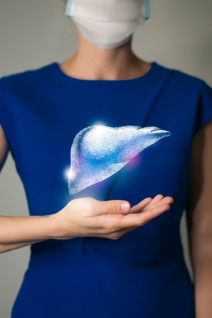 Woman in blue clothes holding virtual volumetric drawing of Liver in hand. Handrawn human organ, detox and healthcare, healthcare hospital service concept stock photoの写真素材