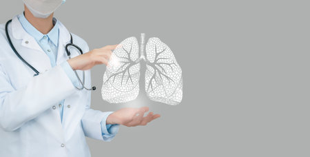 Female doctor holding virtual Lungs in hand. Handrawn human organ, copy space on right side, raw photo colors. Healthcare hospital service concept stock photoの写真素材